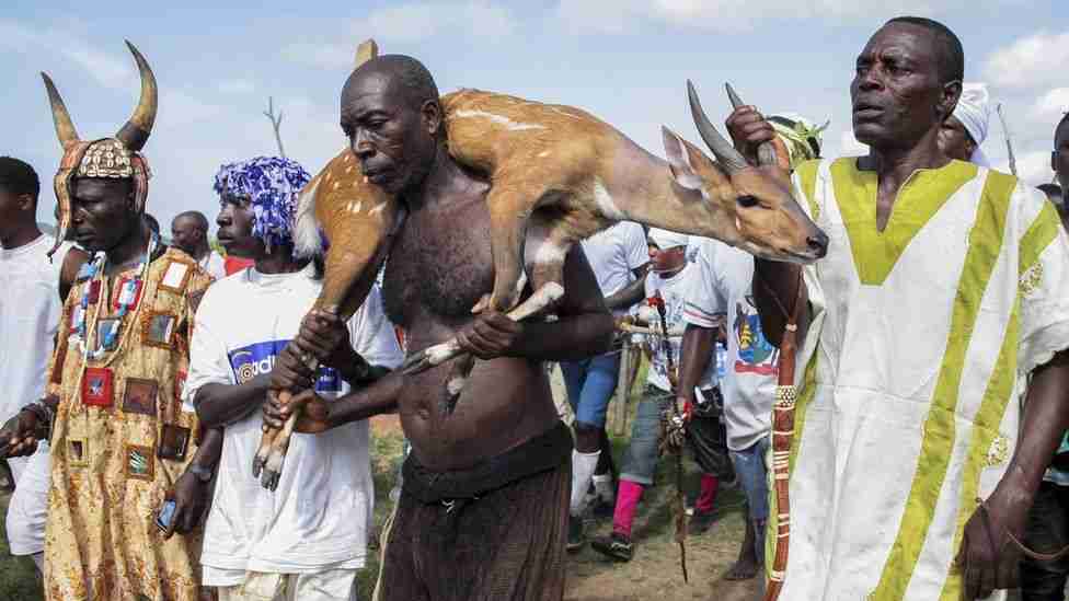 Man with a deer around his neck at the Aboakyer festival 