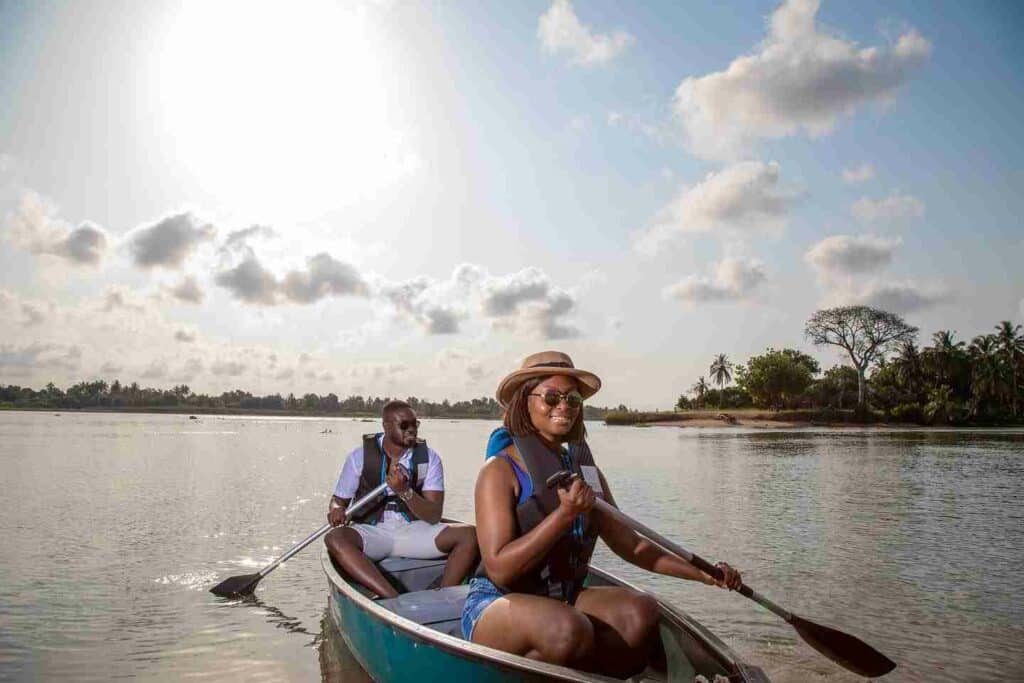 Man and Woman paddling a small boat