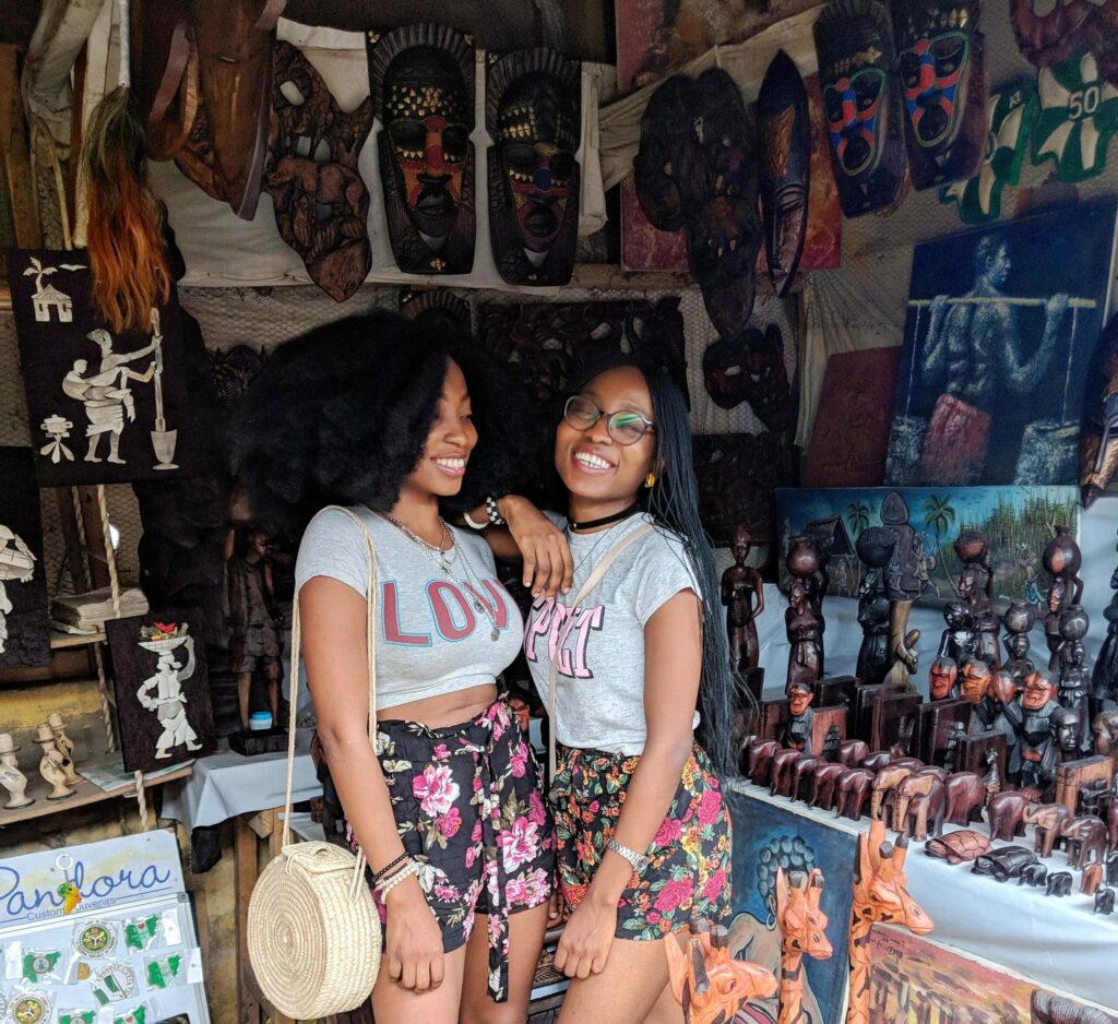 Beautiful women smiling as they shop at the Lekki Arts & Crafts Market