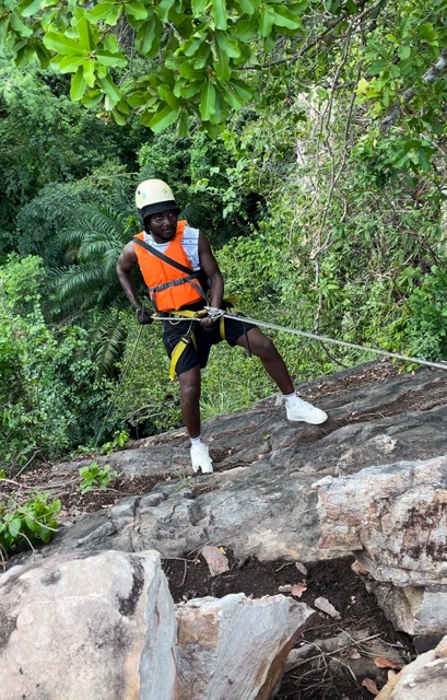 A guy scaling down the Vulcan Rock in Akosombo during Escape To Akosombo abseiling adventure.